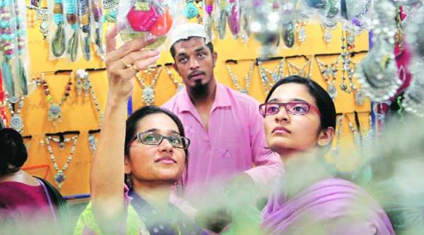 A Muslim shopkeeper sells accessories for Navratri, in Vadodara on Wednesday. (Source: Express photo by Bhupendra Rana