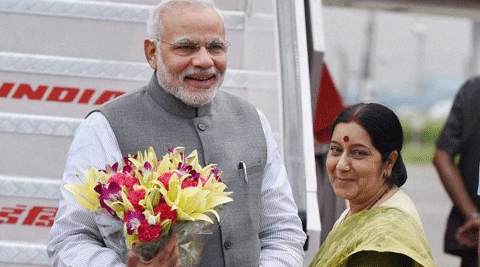 Prime Minister Narendra Modi being welcomed by Foreign Minister Sushma Swaraj upon his arrival at AFS Palam in New Delhi on Wednesday, Sept 3,  after his Japan tour. (Source: PTI photo)