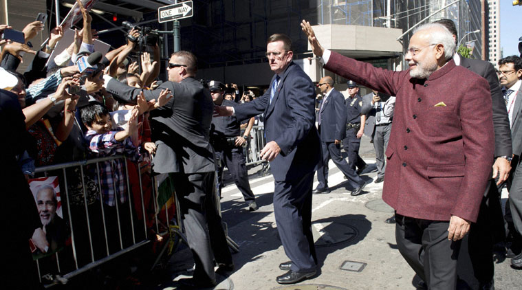 Prime Minister Narendra Modi greets people outside his hotel upon his arrival in New York on Friday. (Source: PTI)
