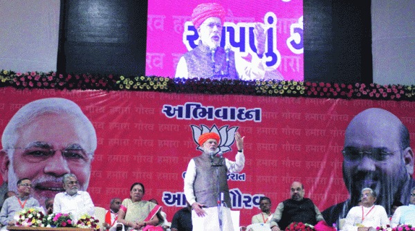 Prime Minister Narendra Modi addresses a gathering in Ahmedabad on Tuesday. (Express photo by Javed Raja)