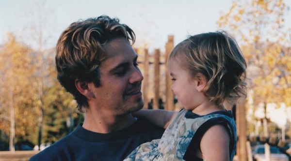 Meadow posted a photo of her as a toddler being held by her dad.