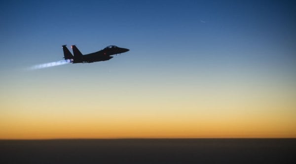  U.S.-led coalition warplanes bombed oil installations and other facilities in territory controlled by Islamic State militants in eastern Syria on Friday. (Source: AP)