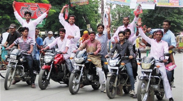 Samajwadi Party (SP) workers celebrate the party's victory at the Uttar Pradesh by-elections in Allahabad on Tuesday. Source: PTI Photo