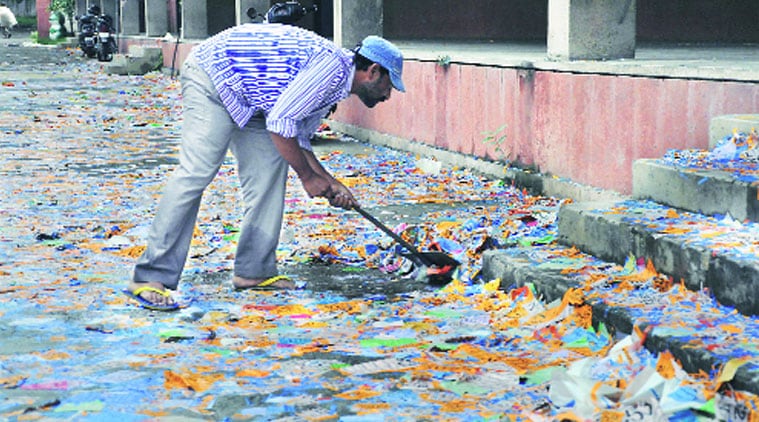 Leaflets being removed a day after student’s election at PU’s Law Auditorium. (Source: Express photo by Sahil Walia)