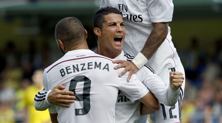 Rael Madrid's Cristiano Ronaldo celebrates his goal against Villareal with his teammates.  (Source: AP)