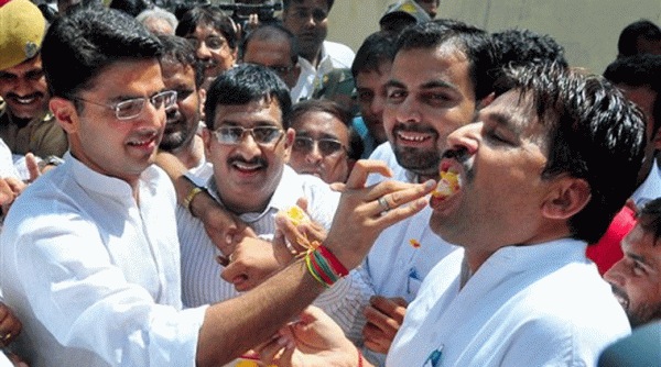Rajasthan Congress President Sachin Pilot celebrates with party workers the party's victory in the bypolls at the party office in Jaipur on Tuesday.Source: PTI photo