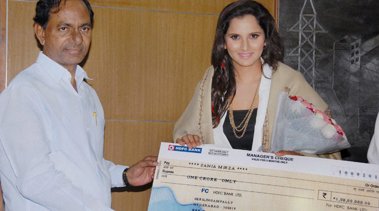 Telangana CM K Chandrashekhar Rao felicitates Sania Mirza with a cheque of Rs 1 crore in Hyderabad on Thursday. (Source: PTI)