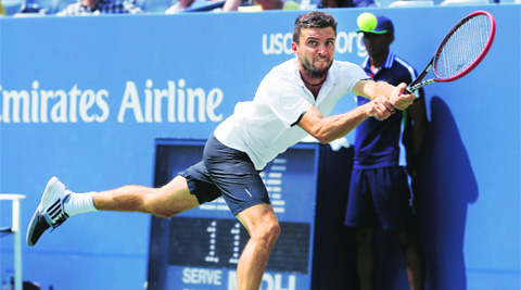 Gilles Simon in action during his 6-3, 3-6, 6-1, 6-3 win over David Ferrer. (Source: AP photo)