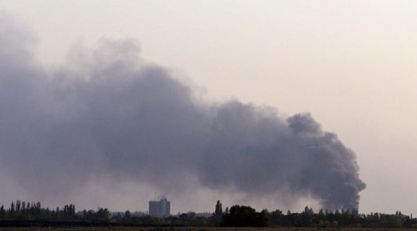 Smoke rises after shelling near the town of Donetsk, eastern Ukraine, Sunday, Sept. 28, 2014.