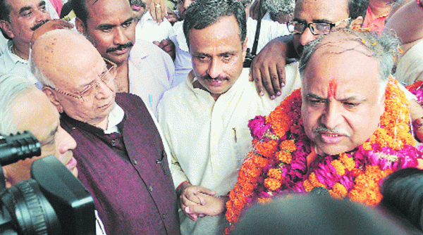 Winning BJP candidate from Lucknow East Seat Ashutosh Tondon celebrates with father Lalji Tondon and mayor Dinesh Sharma in Lucknow on Tuesday. (Source: Express photo by Pramod Singh)