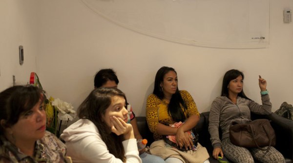 In this Sept, 4, 2014 photo, breast implant patients sit in a waiting room at the metropolitan outpatient surgery center in Caracas, Venezuela. (Source: AP)