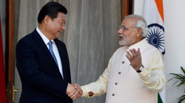 Prime Minister Narendra Modi and Chinese President Xi Jinping shake hands during a meeting at Hyderabad House in New Delhi on Thursday. 