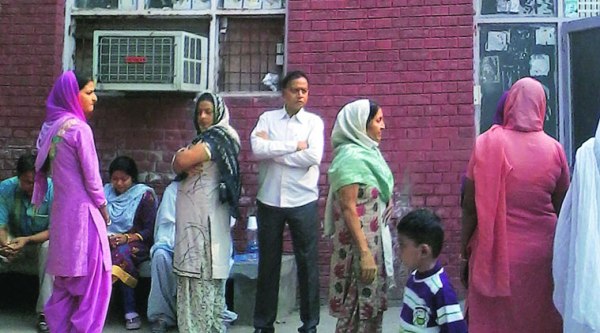 Families of both the victims wait outside the mortuary of the Mohali Civil Hospital, Phase 6, on Tuesday.  (Source: Express photo)