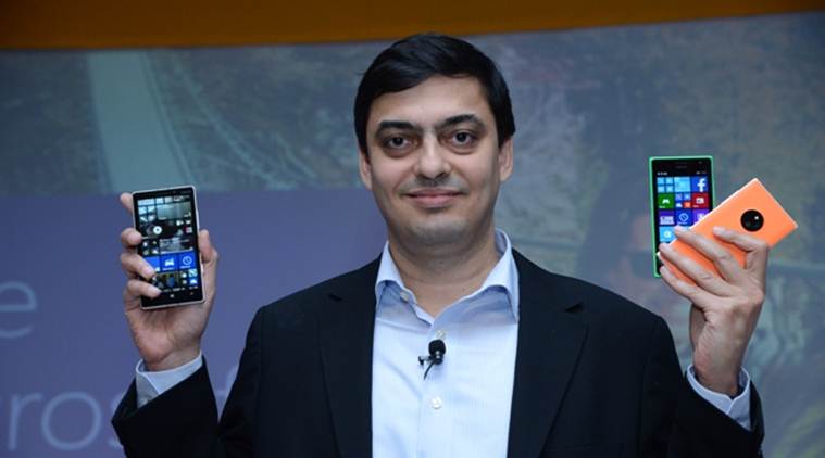 Ajey Mehta, MD of Nokia India Sales Pvt Ltd, poses with the Lumia 730, 830 and 930. 