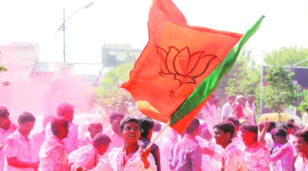 BJP supporters celebrate the party’s unprecedented victory in Pune city, at Chhatrapati Shivaji Sports Complex, Balewadi, where the votes were counted Sunday. (Source: Express photo by pavan Khengre)