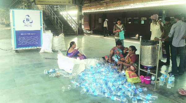 Employees at work at the Ahmedabad railway station. 