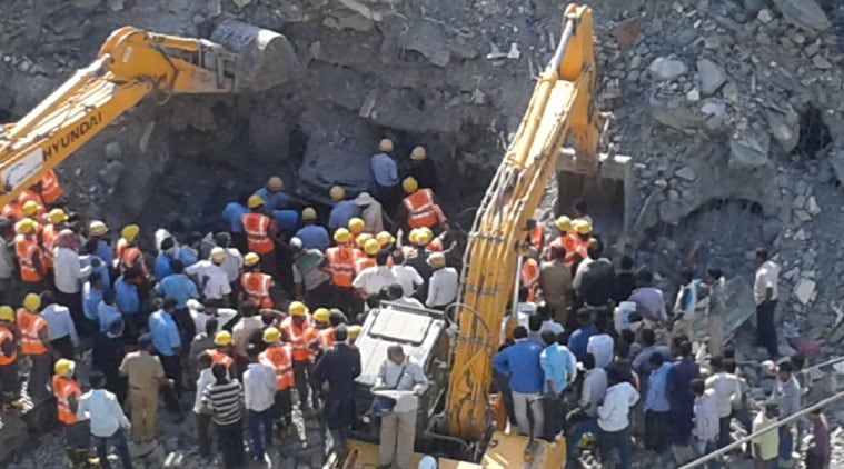 The rescue work going on at the building collapse site. The NDRF and Fire Brigade officials are yet to locate Sandip Mohite (29) who's trapped under the debris. (Express Photo by Arul Horizon).