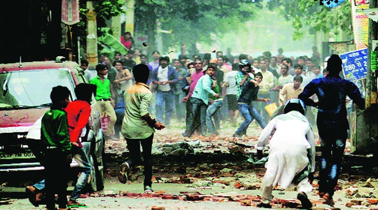 Hindus, Muslims clash in Trilokpuri on Saturday. Forces struggled to contain the violence that began Friday. (Source: Praveen Khanna)