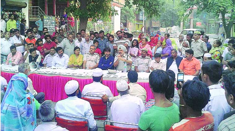Police hold a peace meeting with Nand Nagri residents on Thursday. (Source: EXPRESS PHOTO)