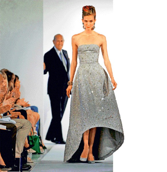 Oscar de la Renta in the background of his Spring Summer 2013 collection at fashion week in New York.