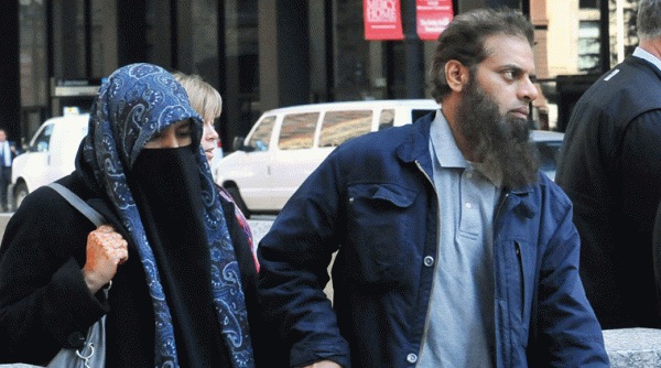 The parents of Mohammed Hamzah Khan from Bolingbrook, Ill., leave the Dirksen federal building Monday, Oct. 6, 2014 in Chicago. (Source: AP)