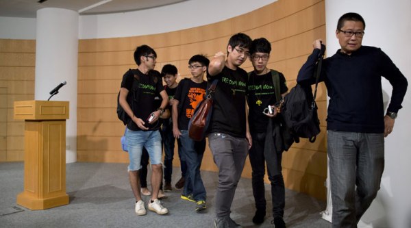 Occupy Central civil disobedience movement founder Chan Kin-man, right, and student leaders from second right, Nathan Law, Alex Chow, Joshua Wong, Lester Shum and Eason Chung, leave the news conference after their talks with the Hong Kong government officials in Hong Kong Tuesday, Oct. 21, 2014. (Source: AP)