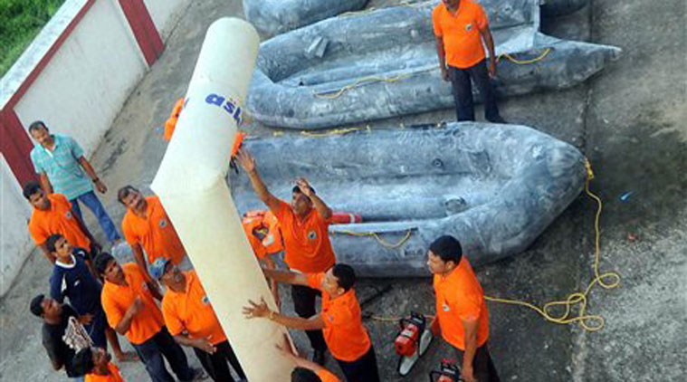 Odisha Disaster Rapid action force (ODRAF) personnel checking up their equipment in preparation ahead of cyclone HudHud in Bhubaneswar on Wednesday. (Source: PTI)