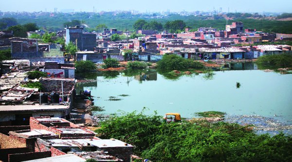 Sewer carrying chemical waste and industrial effluents from Tughlaqabad village swamp’s original water body. (Source: Express photo by Oinam Anand)
