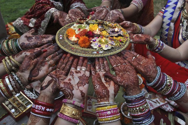 Indian Hindu married women perform rituals on Karva Chauth festival. (Source: AP)