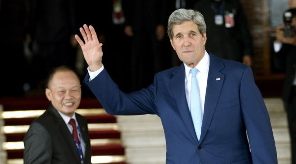 U.S. Secretary of State John Kerry waves as he arrives for the inauguration of Indonesia's seventh President Joko Widodo at Parliament in Jakarta, Indonesia, Monday, Oct. 20, 2014. (Source: AP)