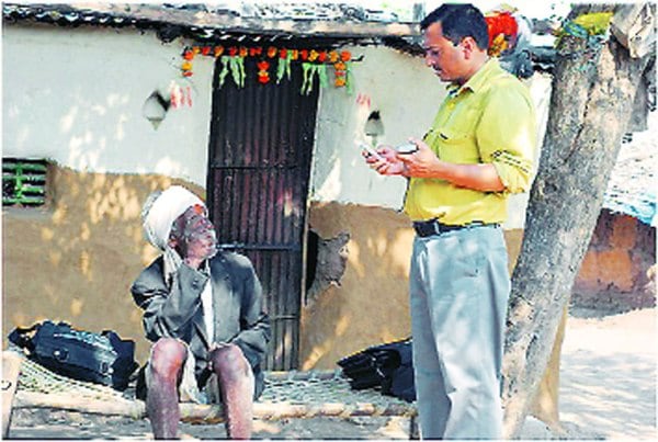 Shailendra Mohan interacts with a villager in Jalgaon.