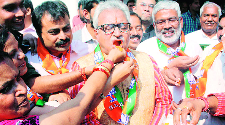 State BJP president Laxmikant Bajpai celebrates the party’s wins in Maharashtra and Haryana Assembly elections, at the BJP office in Lucknow, on Sunday. The party, however, lost Kairana Assembly seat to Samajwadi Party. (Source: Express  photo Pramod Singh)