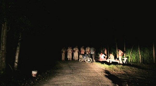 Policemen at the spot where the bodies were found,  in Muzaffarnagar on Monday. Source: Ravi Kanojia