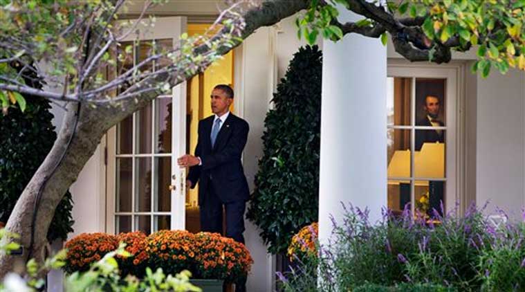 President Barack Obama leaves the Oval Office of the White House in Washington, Tuesday, Oct. 14, 2014, to board the Marine One helicopter on the South Lawn, en route to a meeting at Andrews Air Force Base, Md. where he is expected to discuss coalition efforts against ISIL.  (Source: AP)