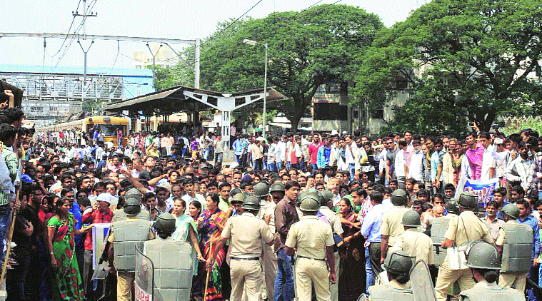 Police force was deployed in large numbers to control the crowd at Pimpri railway station. (Source: Express photo by Rajesh Stephen)