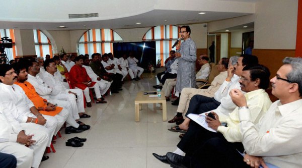 Shiv Sena chief Uddhav Thackeray addresses the newly elected party MLAs at a meeting at Sena Bhavan in Mumbai on Monday. (Source: PTI Photo)