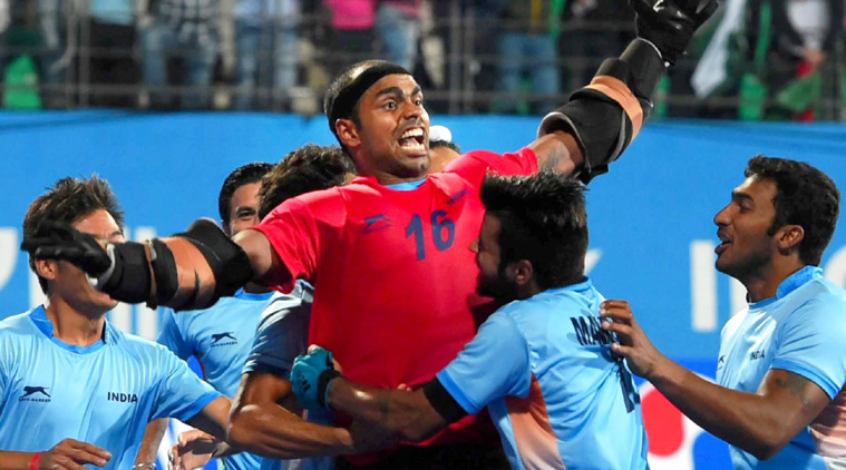 Indian hockey goalkeeper Sreejesh celebrate with team mates after beating Pakistan during the men's hockey final. (Source: PTI) 