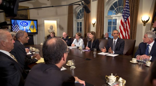 President Barack Obama, second from right, next to Secretary of Defense Chuck Hagel, right, participates in a meeting in the Cabinet Room of the White House in Washington, Wednesday, Oct. 15, 2014, with members of his team coordinating the government’s response to the Ebola outbreak. (Source: AP)