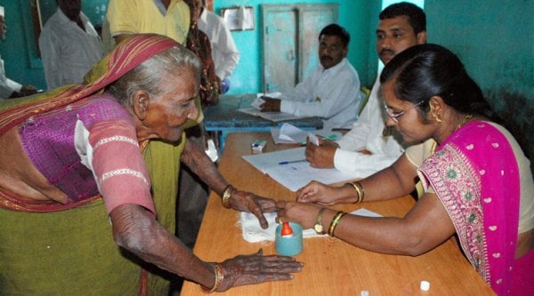 A 100 year old woman cast her vote for the Assembly elections at a polling booth in Karad on Wednesday. (Source: PTI)