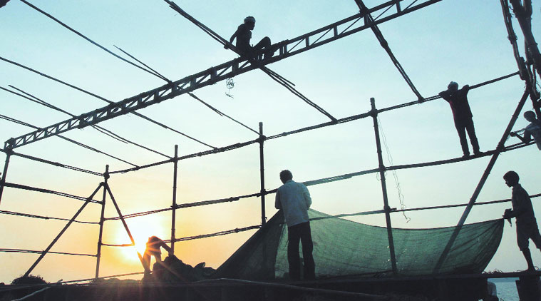 Preparations in full swing at Wankhede Stadium for Friday’s swearing-in ceremony. (Source: Express photo by Pradip Das)