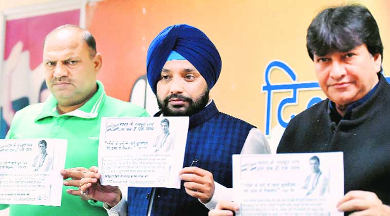 Delhi Congress chief Arvinder Singh with leaders Haroon Yusuf and Mukesh Sharma at the helpline launch on Friday. (Source: PTI)