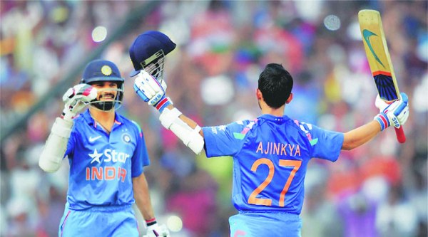 Ajinkya Rahane celebrates after reaching his hundred during the first ODI against Sri Lanka in Cuttack on Sunday. (PTI)