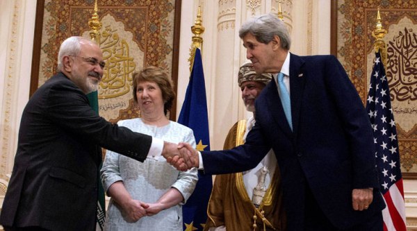 U.S. Secretary of State John Kerry, right, and Iranian Foreign Minister Mohammad Javad Zarif, shake hands during a meeting in Muscat, Oman, Sunday, Nov. 9, 2014. Omani Foreign Minister Yussef bin Alawi bin Abdullah and European Union High Representative Catherine Ashton stand at background. (AP Photo)