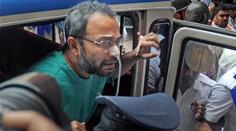  Suspended TMC MP and prime accused in Saradha chit-fund scam Kunal Ghosh being taken out of the hospital after having neurological tests done following his suicide attempt in Kolkata on Saturday. (Source: PTI)