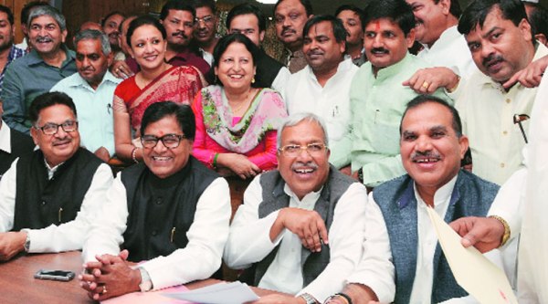 Newly-elected Rajya Sabha members Ram Gopal Yadav with Neeraj Shekhar and others accepting certificates at the state assembly in Lucknow on Thursday. (Source: Express photo by Vishal Srivastav)