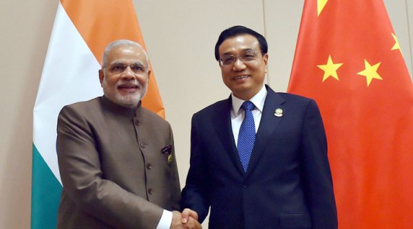 PM Narendra Modi shakes hands with Chinese Premier Li Keqiang during a meeting at Nay Pyi Taw in Myanmar on Thursday. (Source: PTI Photo)