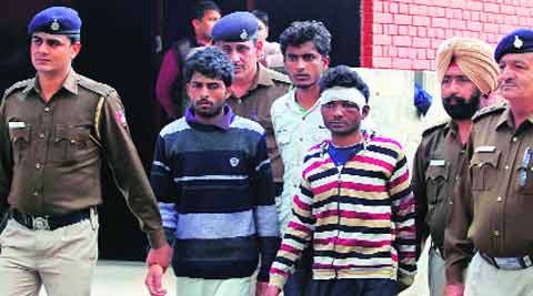 Three accused in police custody in Sector 35, Chandigarh, on Tuesday. (Source: Express photo by Jasbir Malhi)