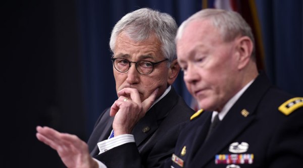 Defense Secretary Chuck Hagel listens at left as Joint Chiefs Chairman Gen. Martin E. Dempsey speaks during a briefing at the Pentagon, Thursday, Oct. 30, 2014. (Source: AP)