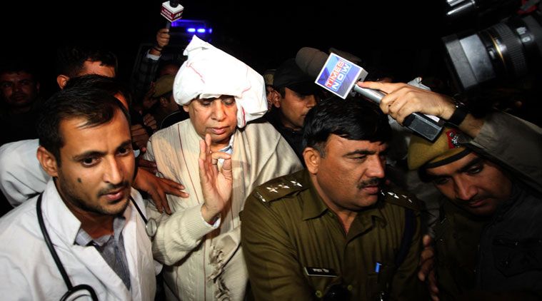 Rampal being taken into police custody. 