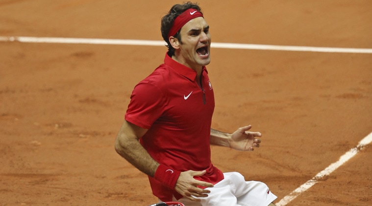 Roger Federer reacts after beating Richard Gasquet 6-4, 6-2, 6-2 to give Switzerland an unassailable 3-1 lead in the Davis Cup finals (Source: AP)